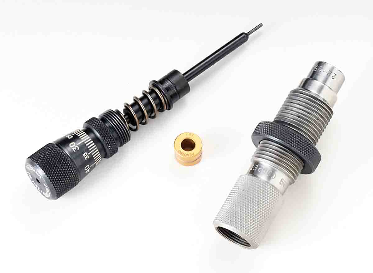 This is a Redding Competition Neck Sizing Bushing Die shown disassembled. The gold colored titanium nitride bushing (center) does not require case neck lubing and is one of many available with different interior diameters in .001-inch increments. The  micrometer permits an adjustment to resize only a portion of the neck length if desired while the case is fully supported within the interior sliding sleeve.